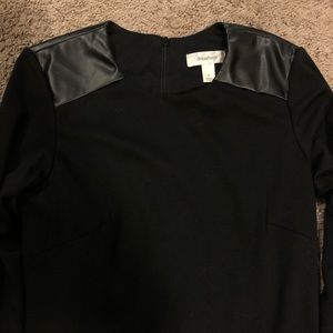 Black with faux leather shoulders